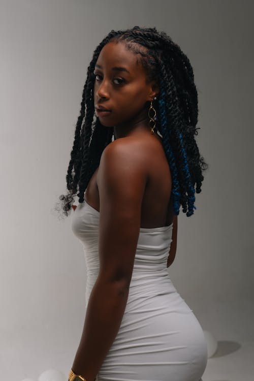 Young Woman Posing in a White Strapless Dress