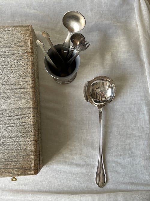 Vintage Cutlery in a Cup on the Table 