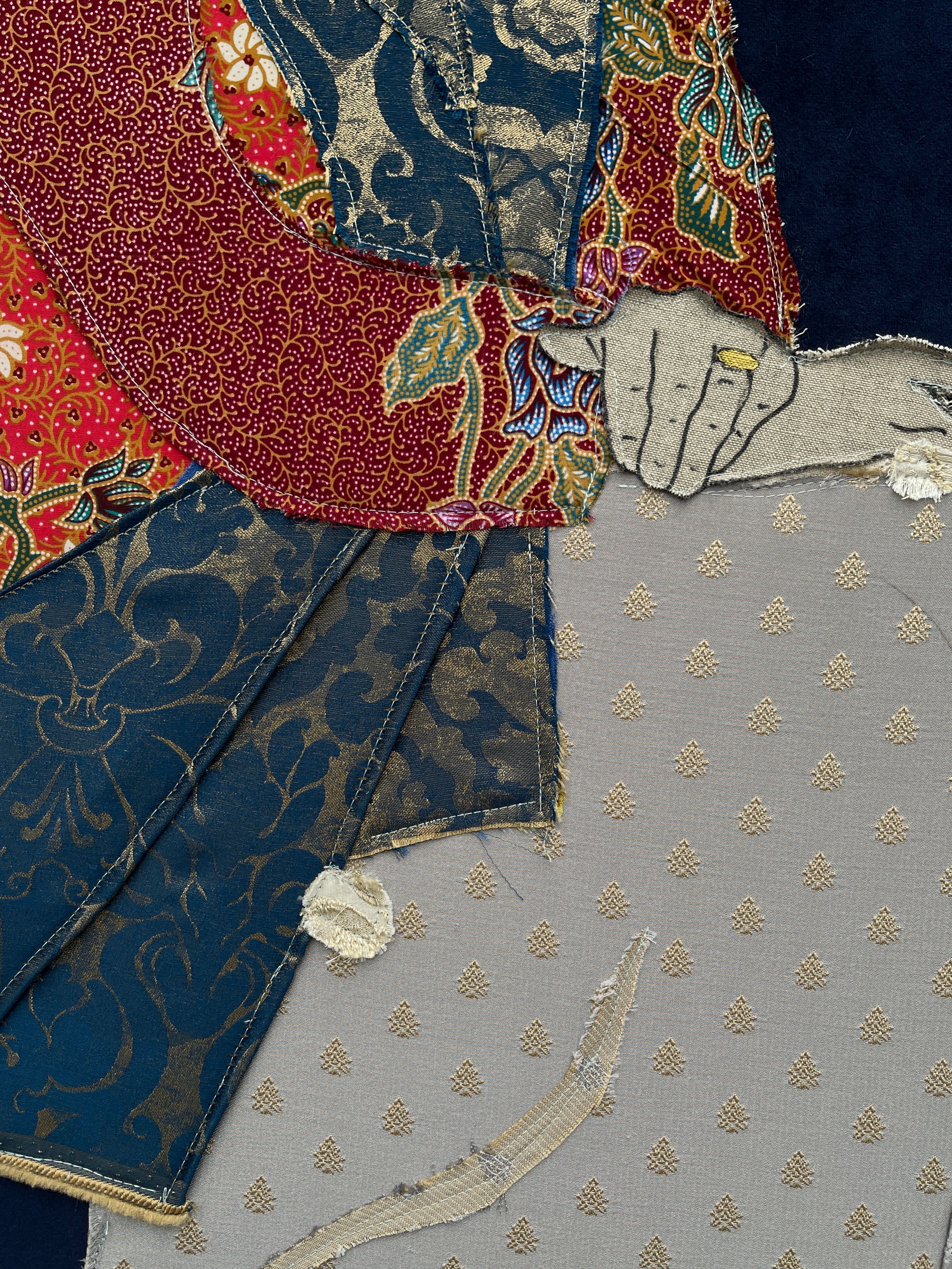 Detailed close-up of colorful fabric artwork showcasing intricate designs and textures.
