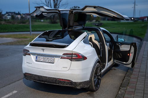 White Tesla Car with Opened Doors