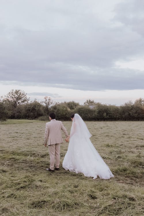 Bride and Groom on a Stroll in Countryside