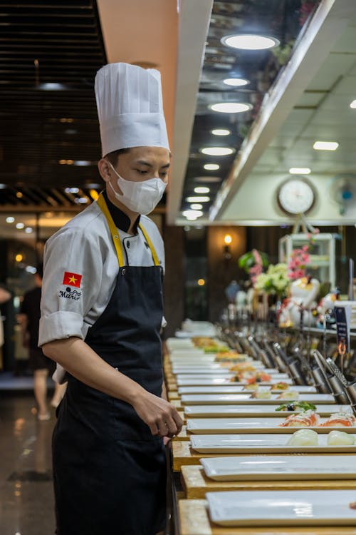 Chef by the Dishes in a Restaurant