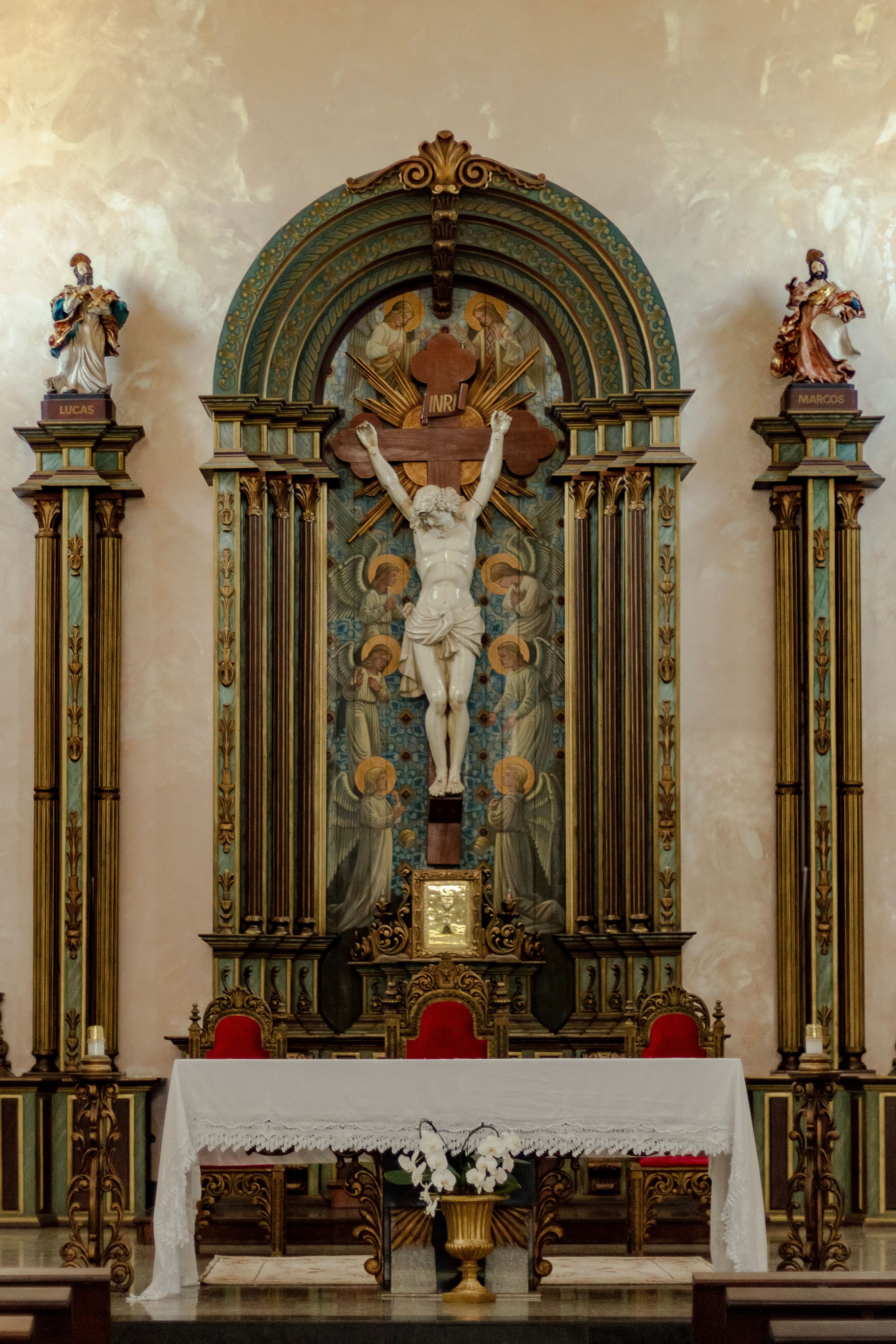 Priest in Black Robe Standing in Front of the Altar · Free Stock Photo
