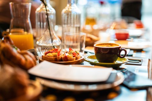 Free A cozy café breakfast setup featuring coffee and delicious tartines. Stock Photo