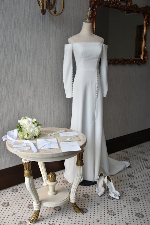 White Dress on Mannequin by Table