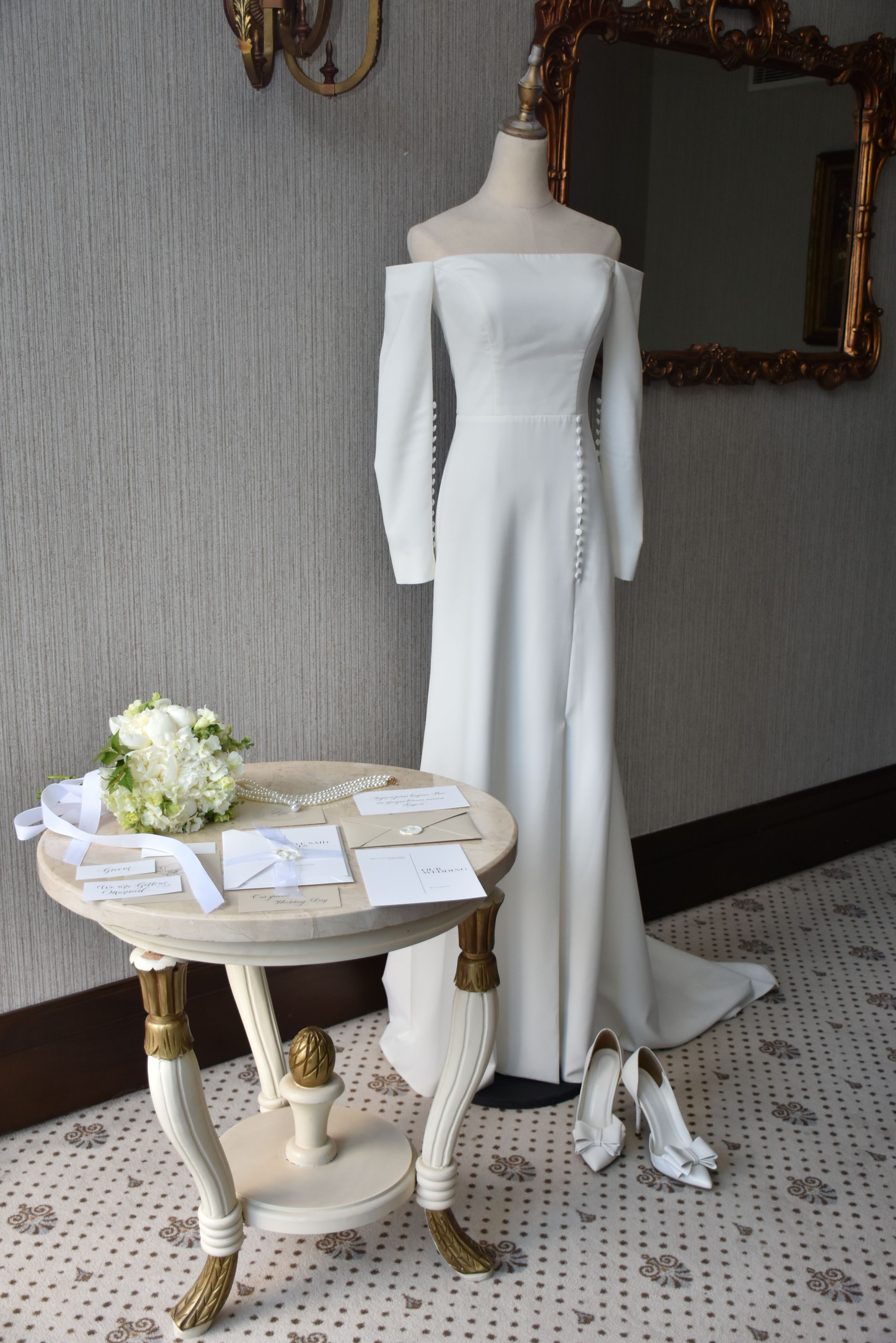 White Dress on Mannequin by Table  Free Stock Photo