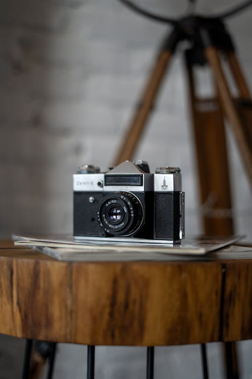 Analogue Camera Lying on Wooden Coffee Table