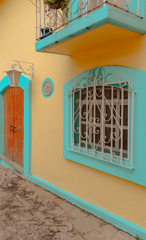 Free Vibrant yellow and turquoise building facade in Oaxaca, showcasing unique architecture. Stock Photo