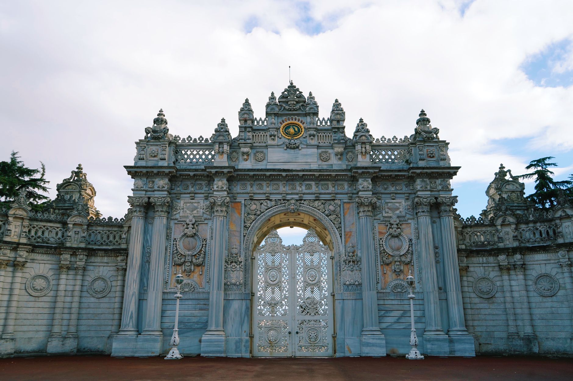 Grand entrance gate of Dolmabahçe Palace showcasing Ottoman architecture in Istanbul.