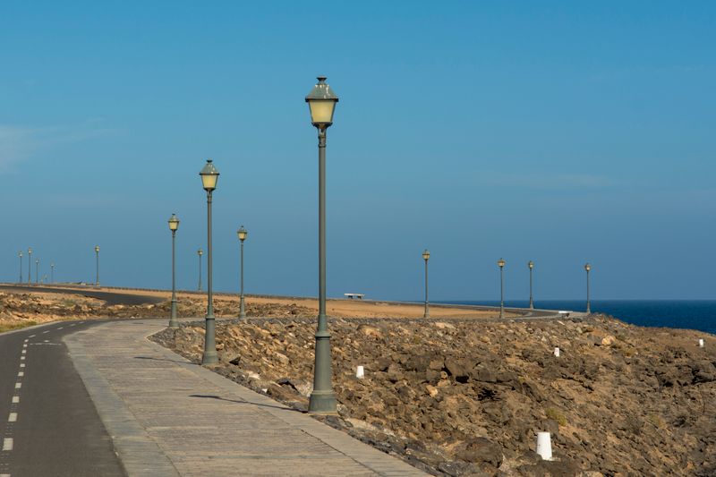 Palm-lined promenade and marina at Caleta de Fuste, Fuerteventura