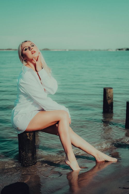 Blonde Woman Posing by the Sea 