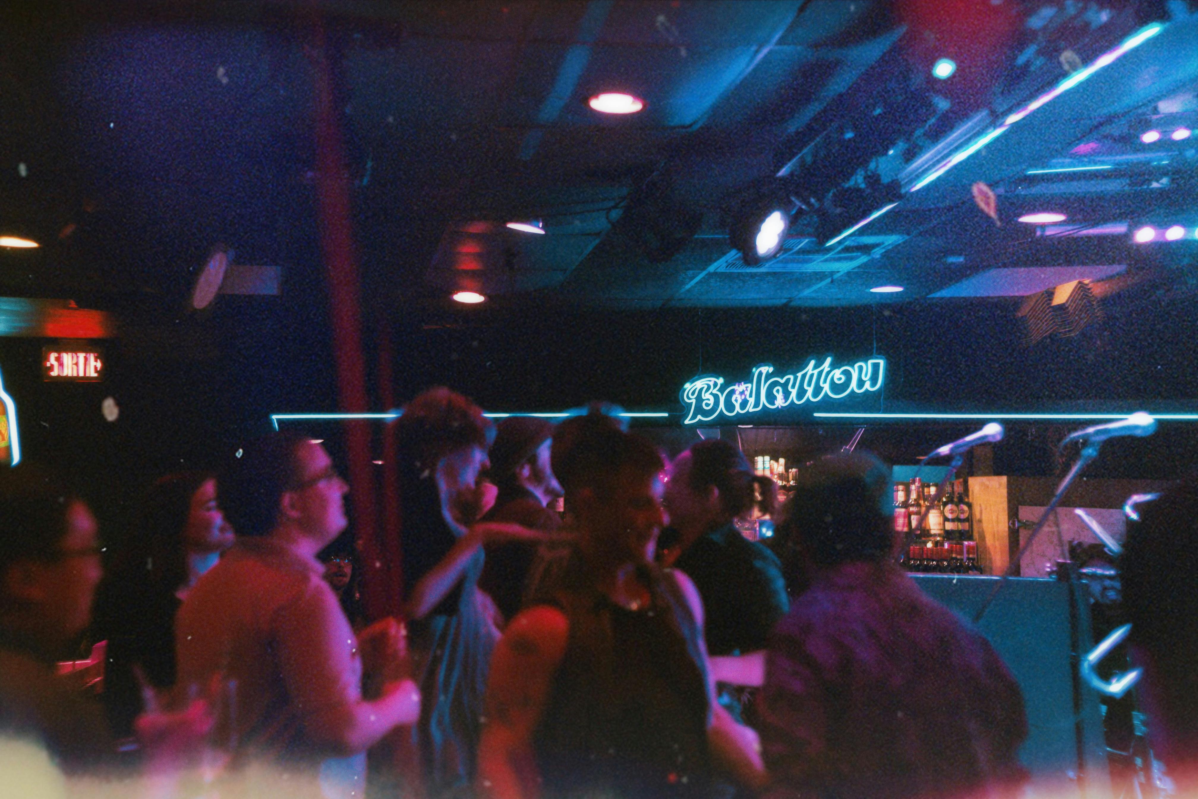 Engaging nightlife scene with people dancing in a club atmosphere at Balattou.