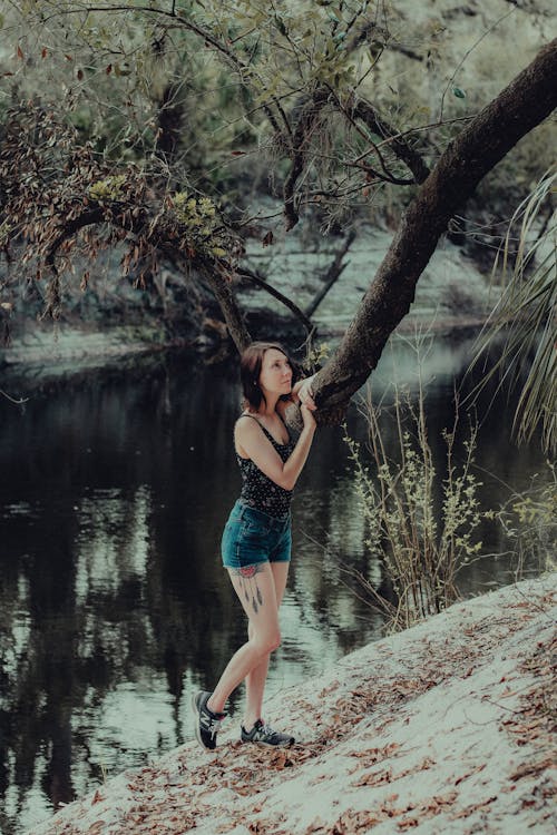 Woman Standing by River