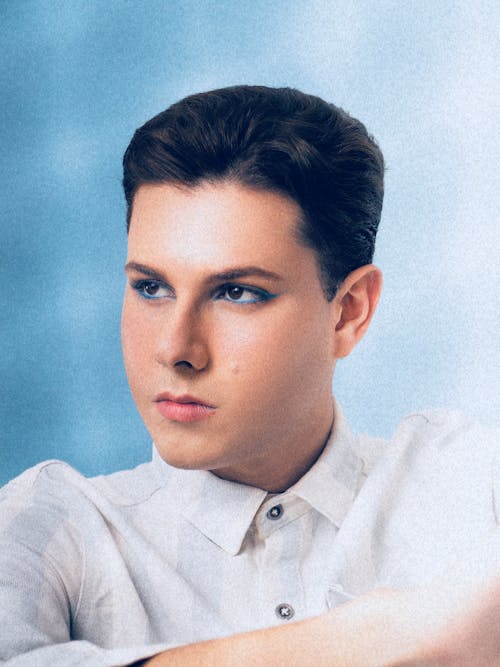Young Teenage Boy with Blue Mascara on Eyes