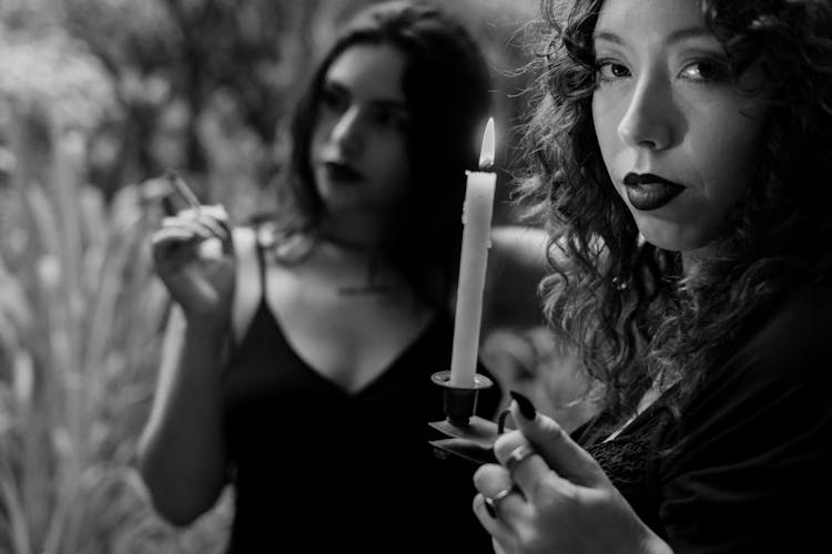 Models With Wax Candle And Smoking Cigarette