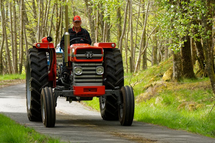 Farmer On Tractor On Road