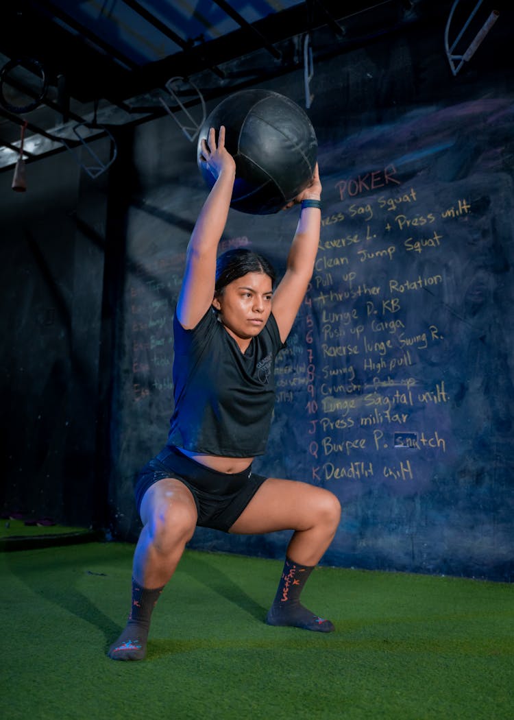 Young Sporty Woman Training In Gym