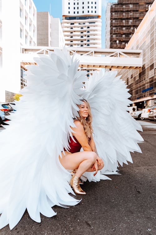 Woman with Angel Wings Posing on Street