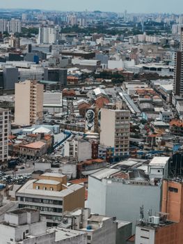 Aerial view of the bustling urban landscape of São Paulo with high-rise buildings and busy streets.