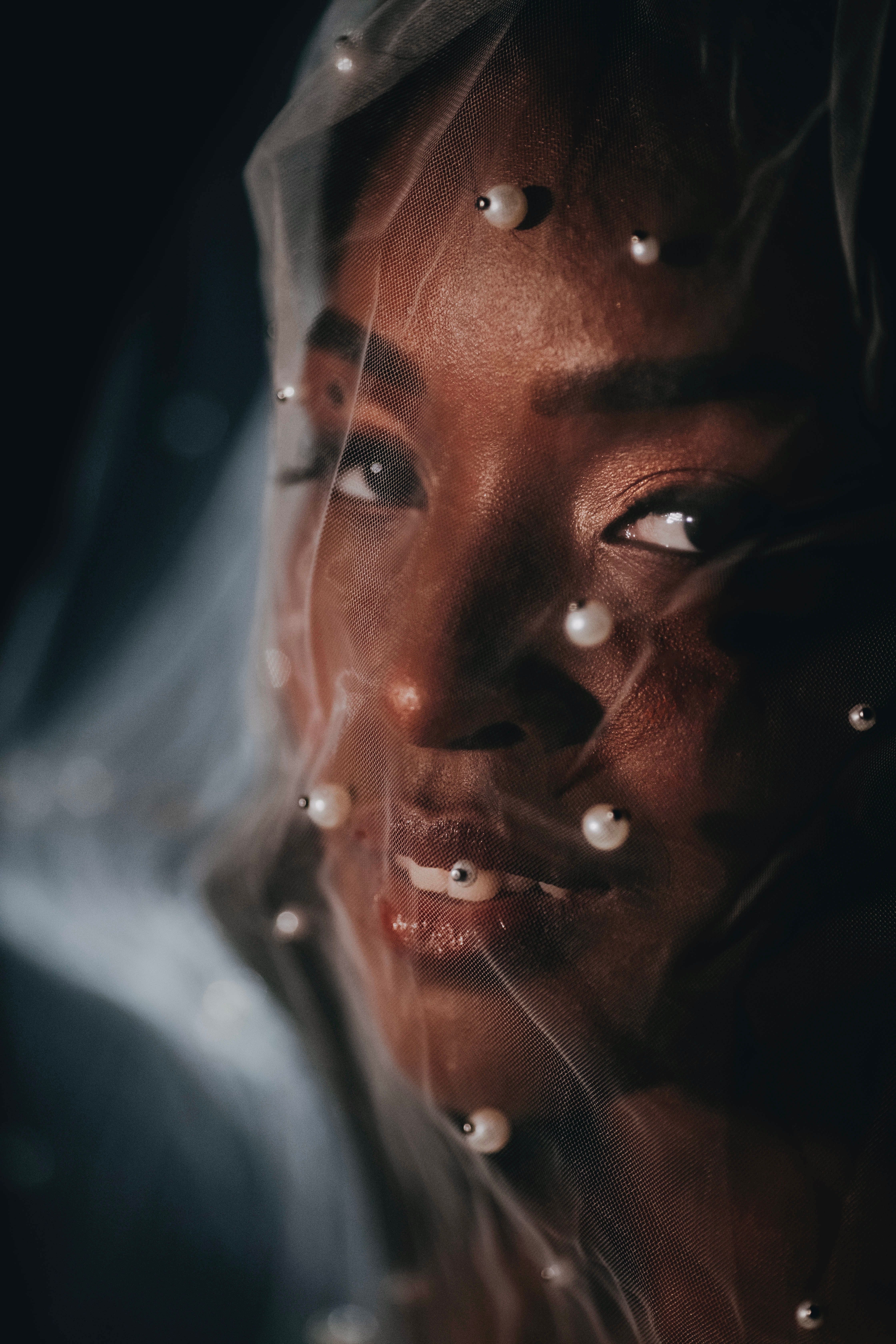 Photo of a Young Woman Wearing a Mesh Veil with Beads on Her Face ...