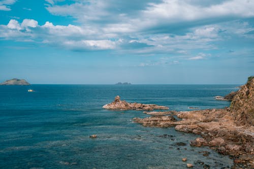 Foto profissional grátis de áspero, azul, costa