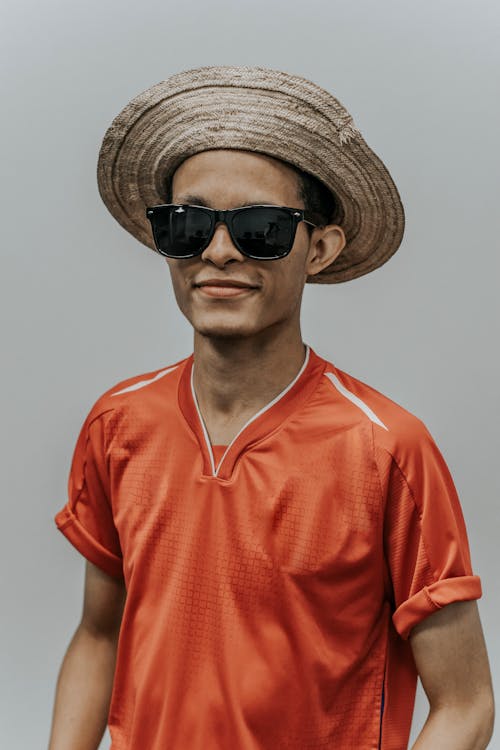 Man Wearing Hat And Orange Shirt