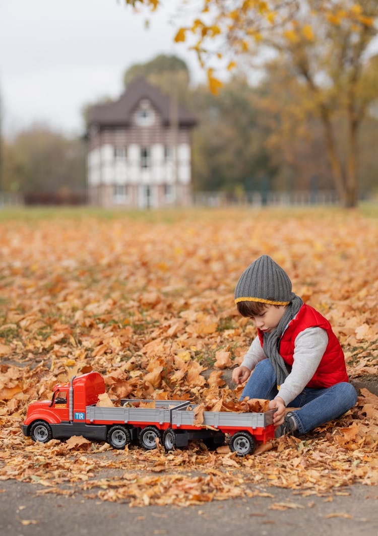 Boy Playing With Toy Truck