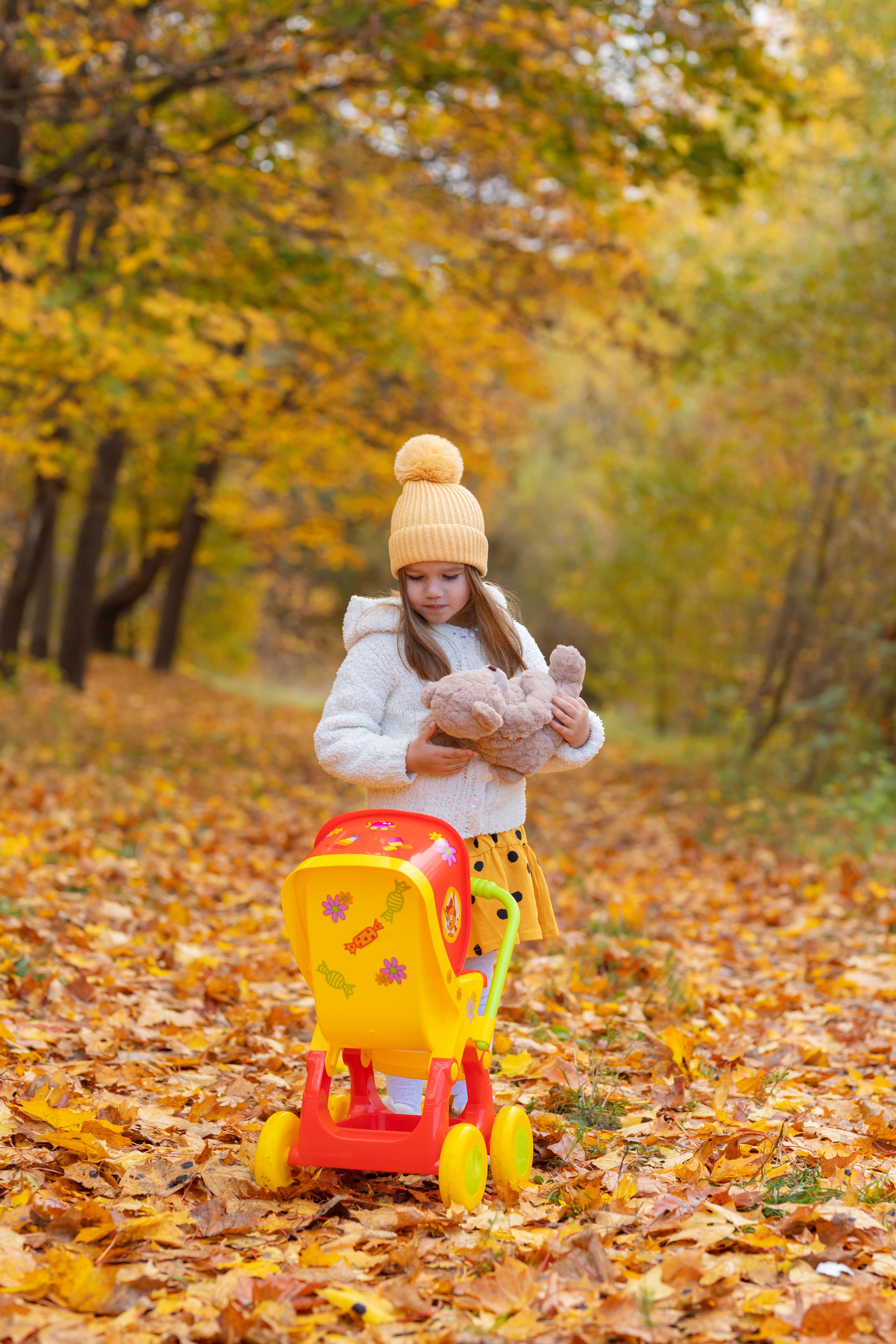 A Girl with Toys in a Forest · Free Stock Photo