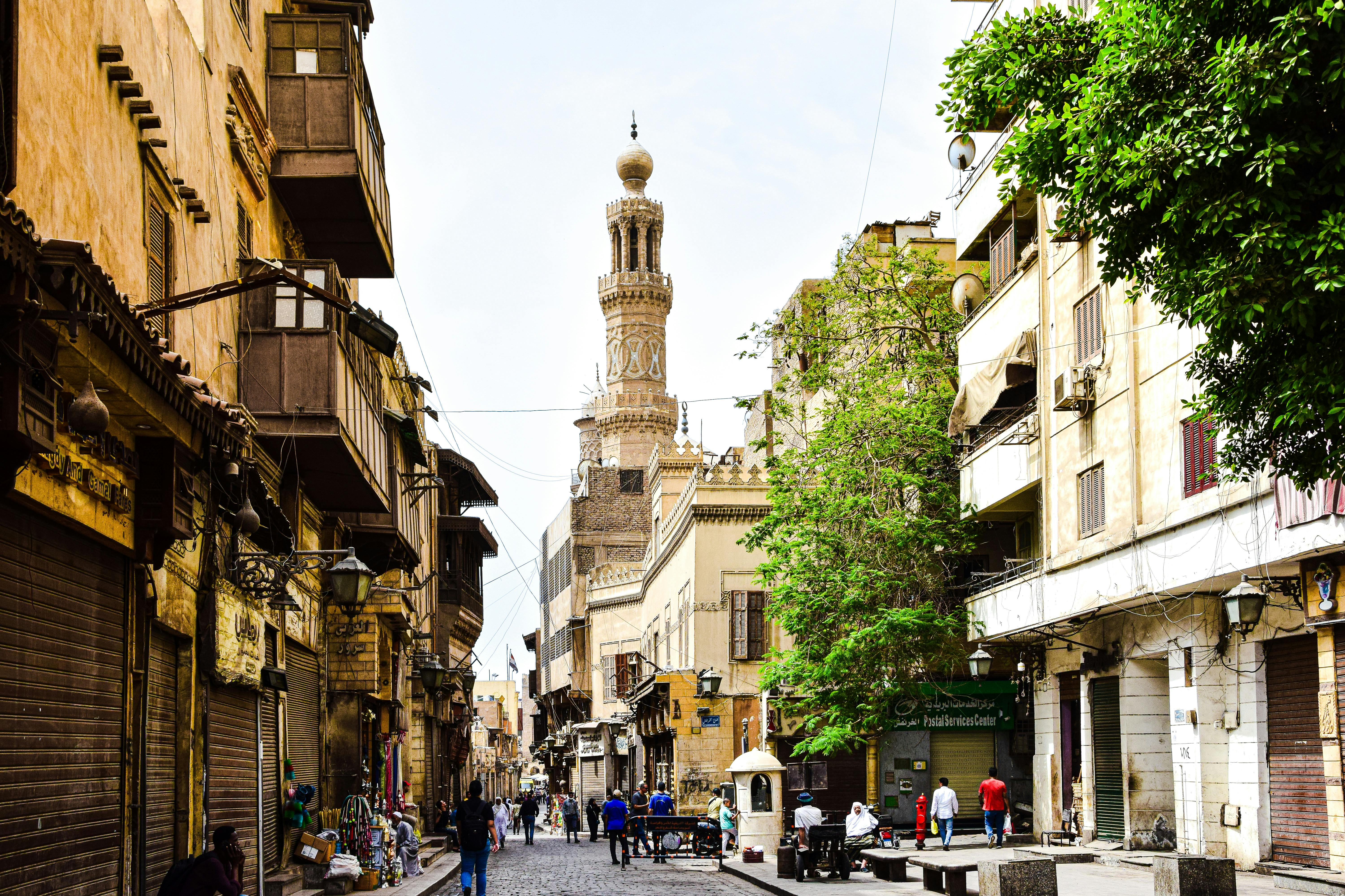 Explore the charm of a bustling historic street in Cairo with stunning architecture and cultural vibrancy.