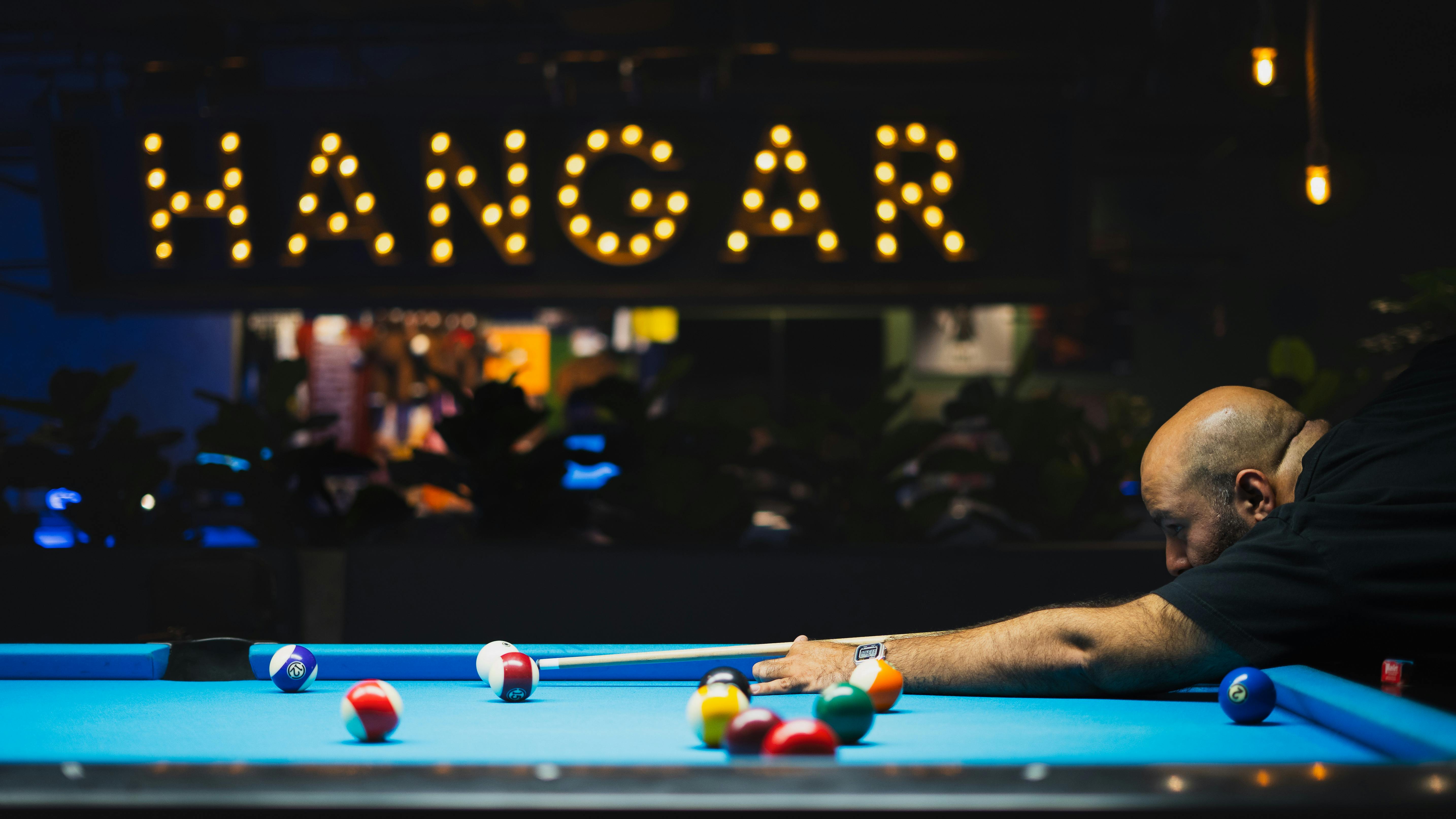 Man Playing Snooker at Nightclub