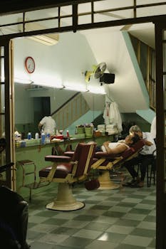 A cozy vintage barbershop scene at night with a customer enjoying a haircut.