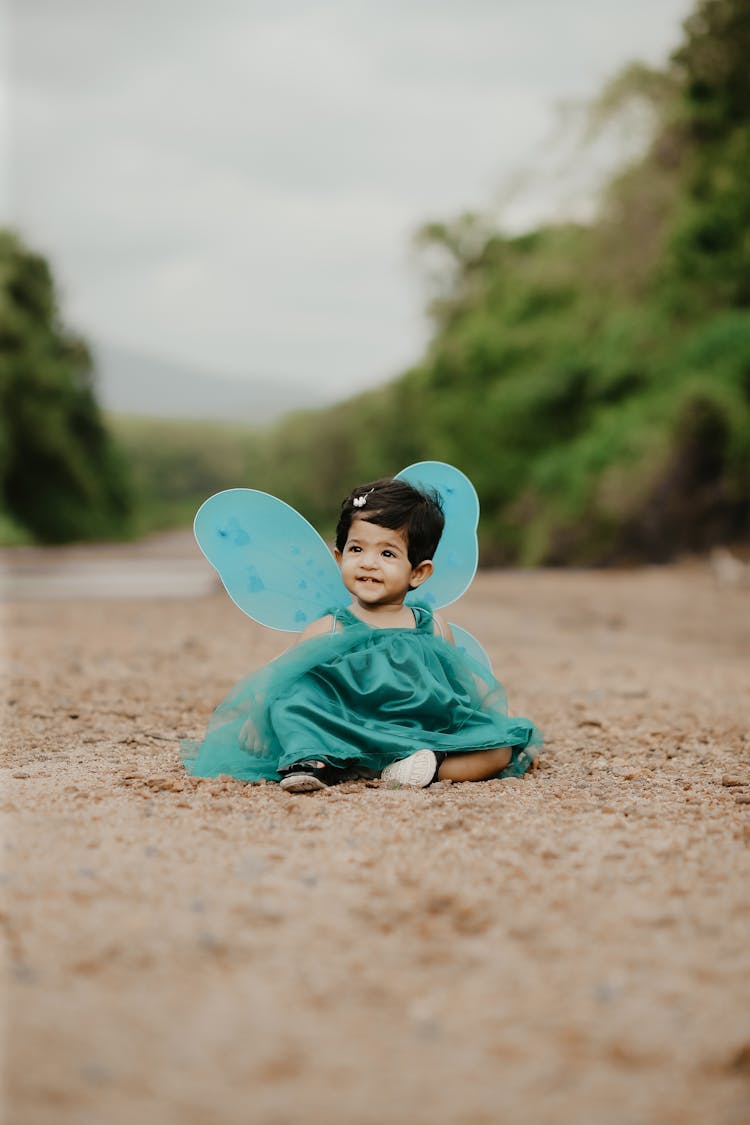 Smiling Girl In Dress With Butterfly Wings