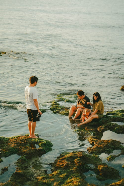 Friends Sitting on Rocks