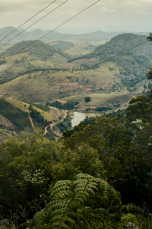 Free Lush green hills and a tranquil valley in Alto Rio Novo, Brazil captured during summer. Stock Photo