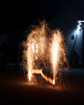 Captivating long exposure of fireworks creating a dramatic scene at night in Prackenbach, Germany.