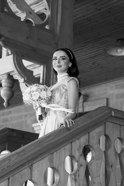 Bride Walking Down the Stairs with a Bouquet
