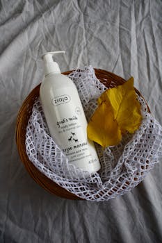 Goat's Milk body lotion in a decorative basket with autumn leaves.