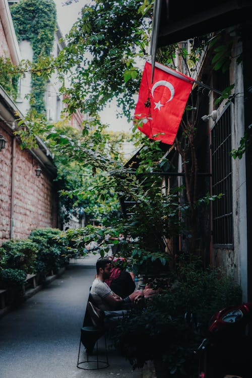 People Sitting in Alley in Town in Turkey