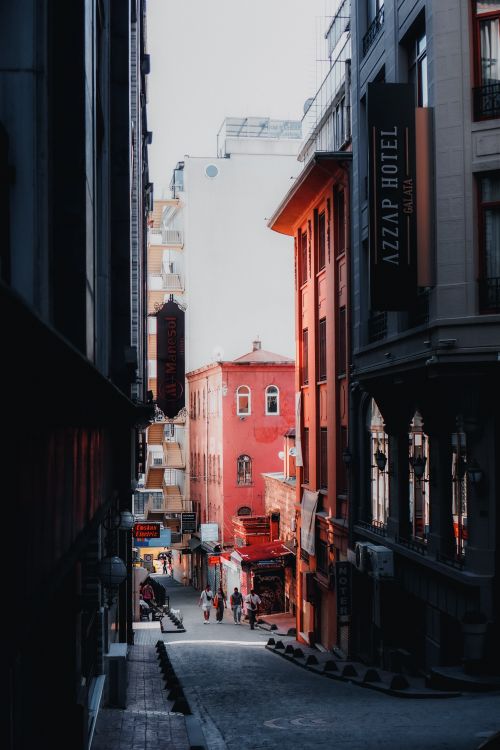 Free Explore a vibrant narrow street in İstanbul lined with unique architecture and bustling life. Stock Photo