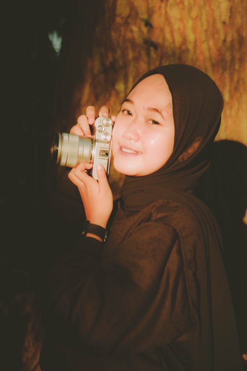 Portrait of Woman in Hijab and with Camera