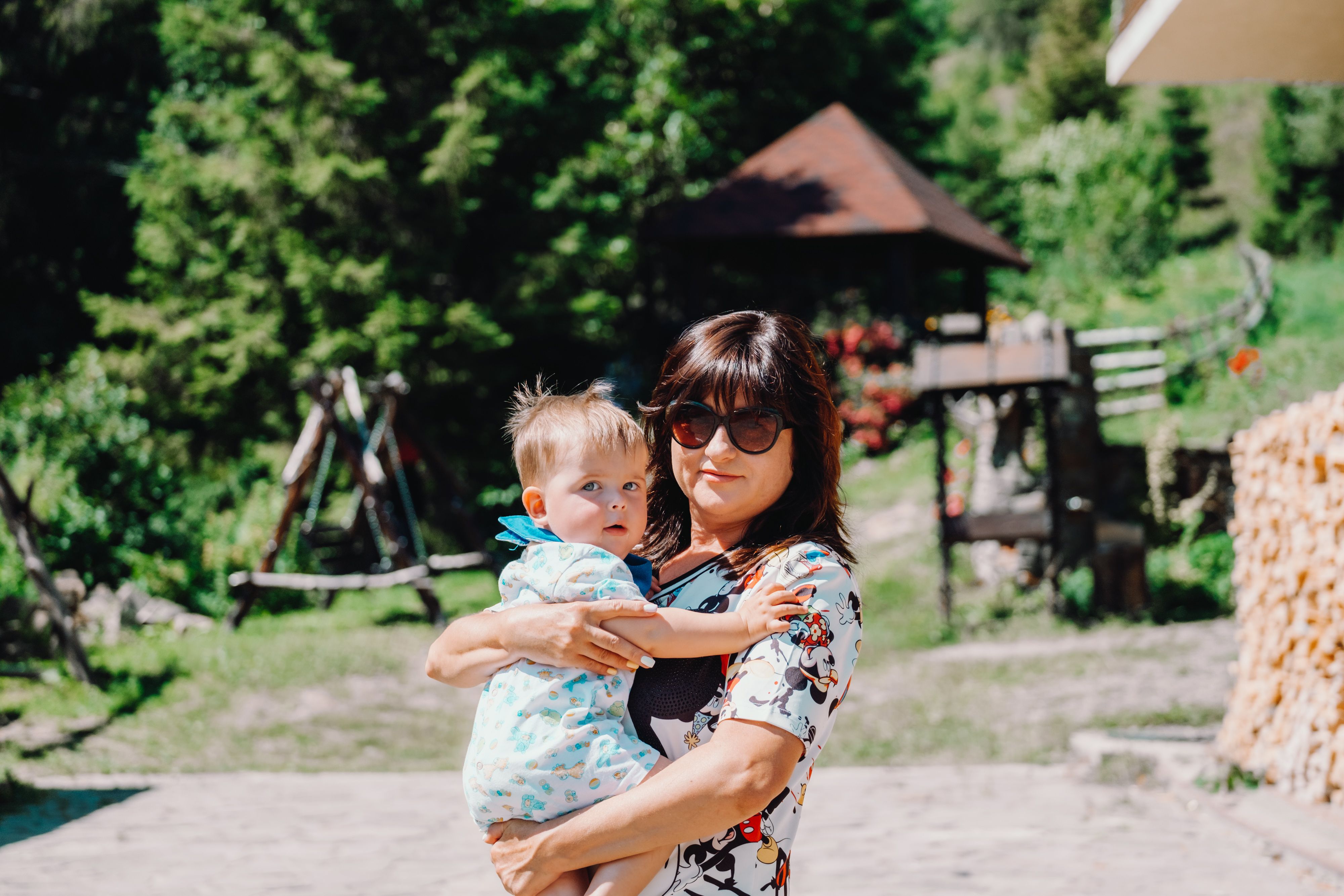 Mother Embracing Child Outdoors - Happy Mother-Child Bonding Moment ...