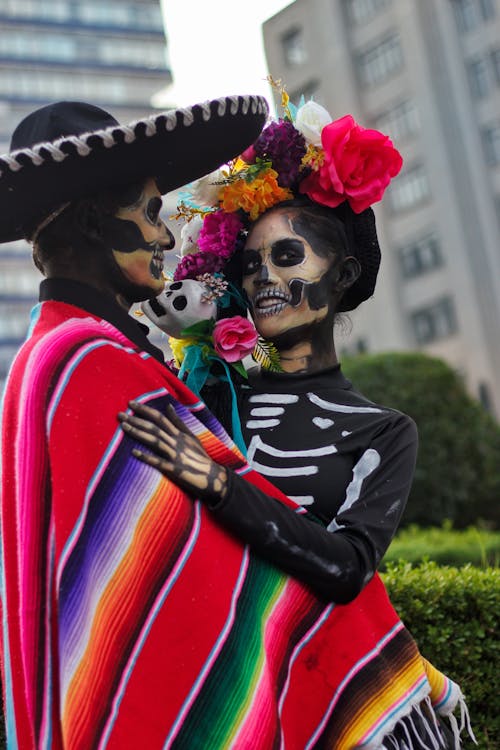 Woman and Man with Painted Face and Traditional, Mexican Clothing