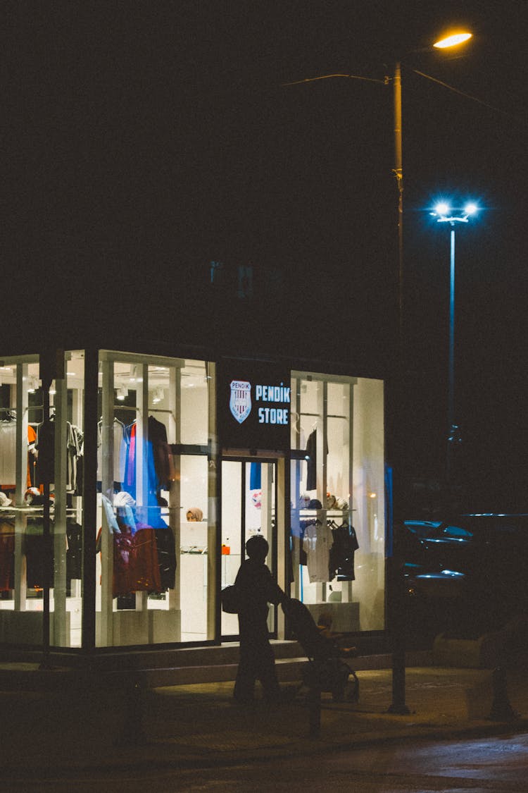 Clothes Shop By The Street At Night 