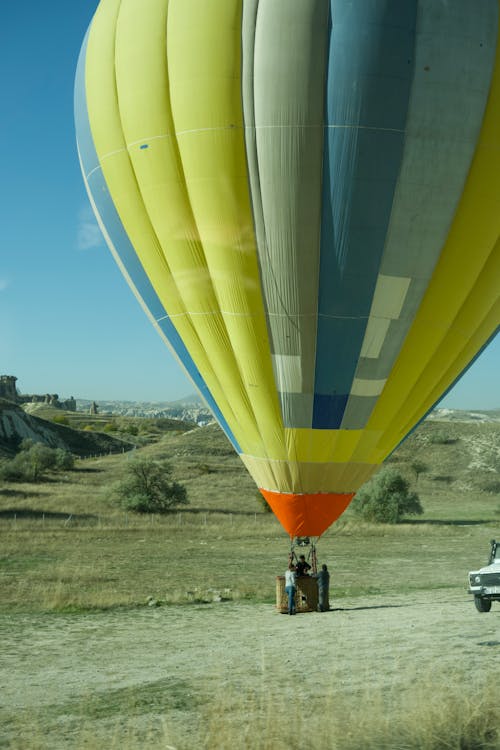 People Preparing a Hot Air Balloon for Flight