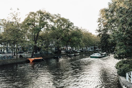 Small Ferry Running Through the City on the Canal