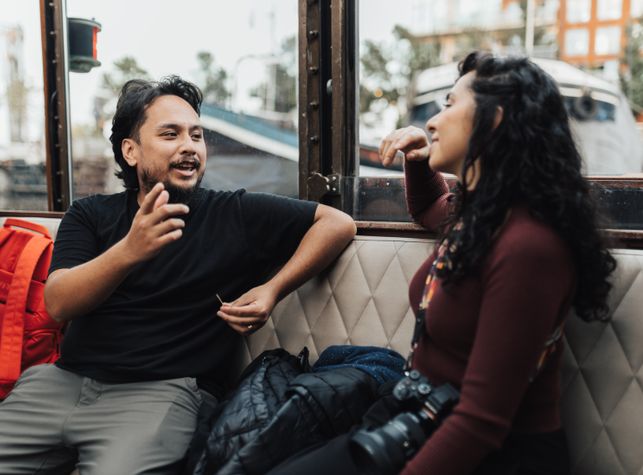 couple enjoying coffee in a local cafe during a date