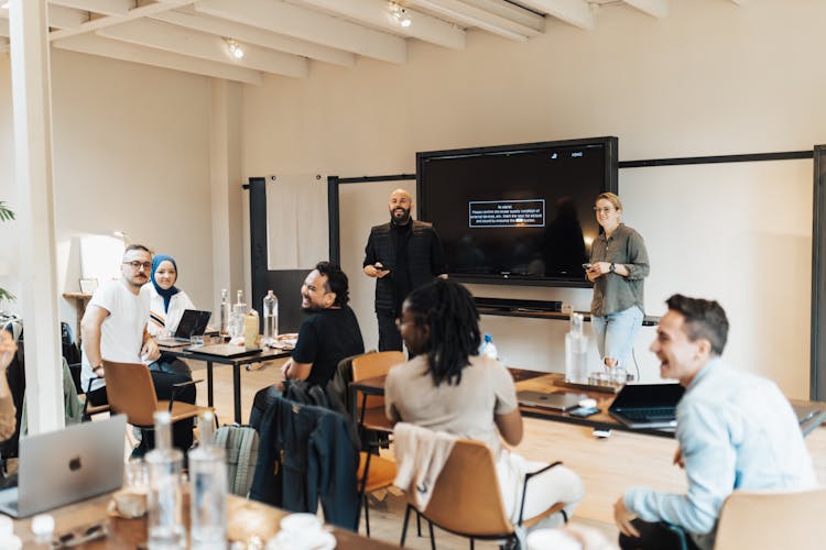 People In Meeting In Office