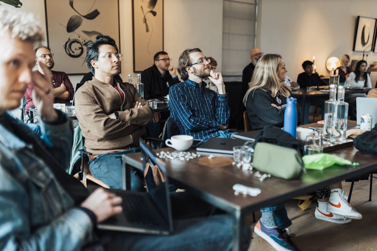 People Sitting At The Table At A Conference 