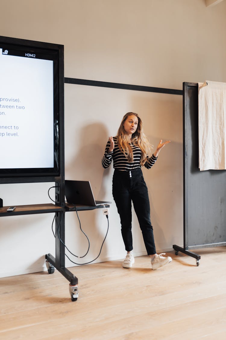 Blonde Woman Standing And Presenting