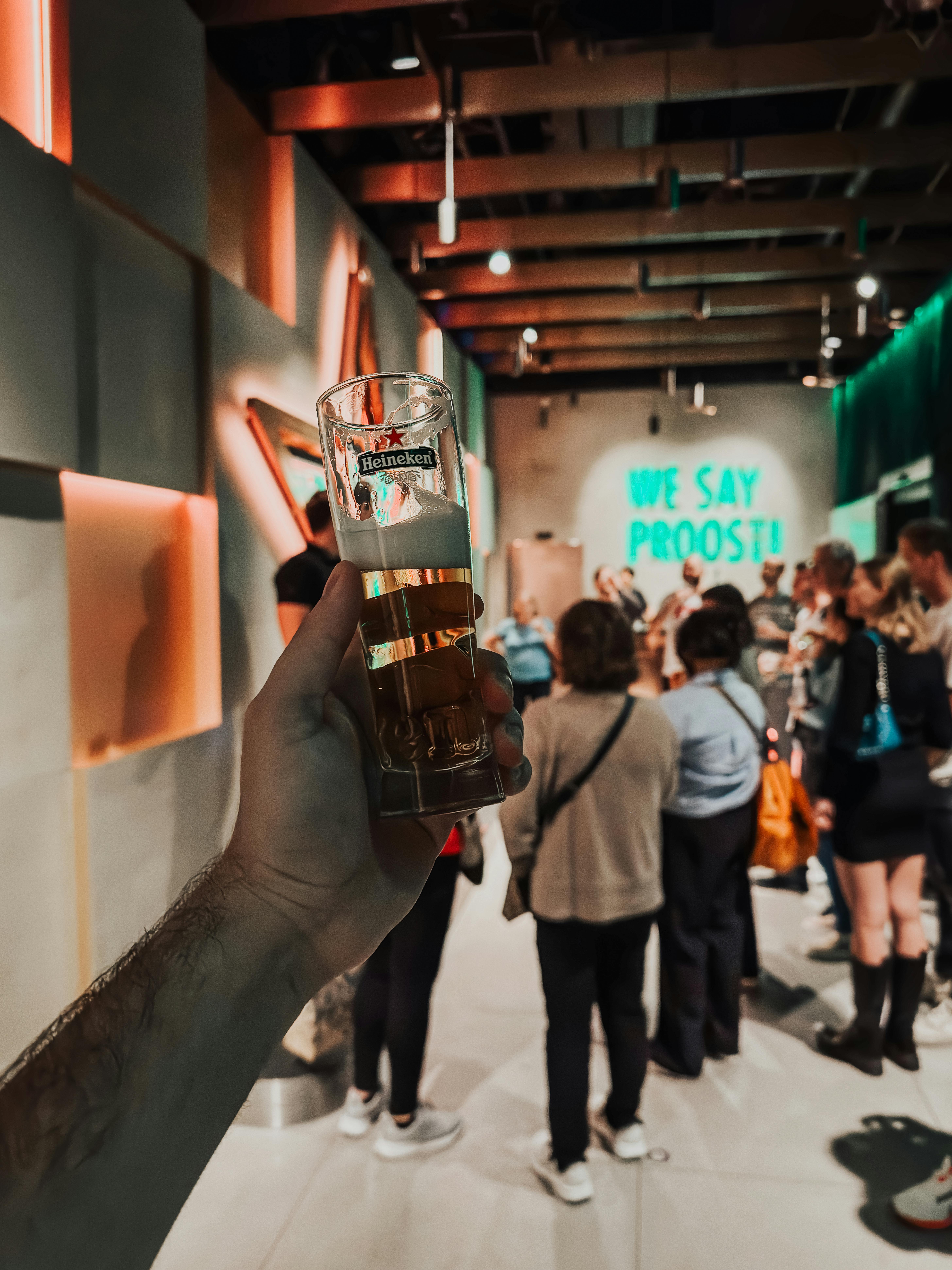 Free Hand Holding a Glass of Beer Stock Photo